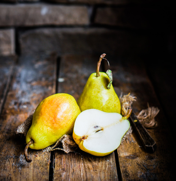 Pears on rustic wooden background - Fotoğraf, Görsel