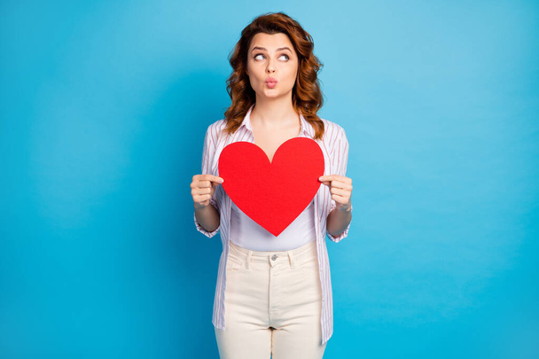 Portrait of her she nice attractive lovely cute dreamy wavy-haired girl holding in hands big paper heart sending air kiss isolated on bright vivid shine vibrant blue color background - Photo, image