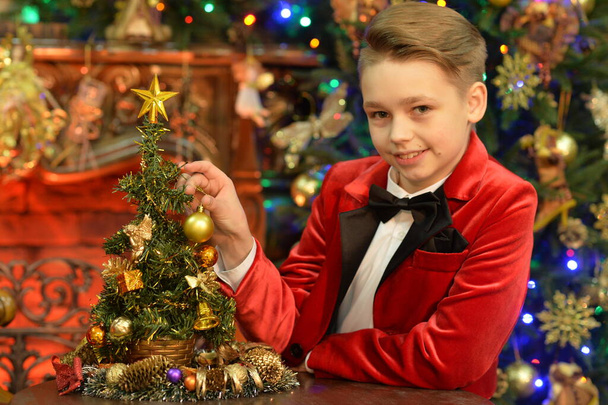 Portrait of little boy with   Christmas tree - Zdjęcie, obraz
