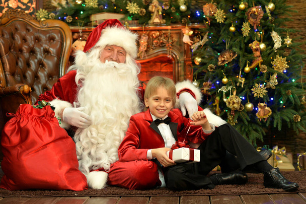  Santa Claus and happy boy on Christmas - 写真・画像