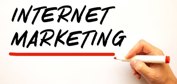 Hand writing INTERNET MARKETING with red marker. Isolated on white background. Business concept. - Foto, Bild