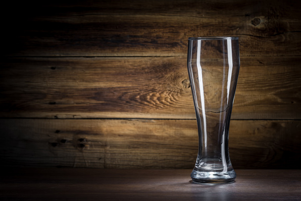 empty beer glass on a wooden background - Фото, зображення
