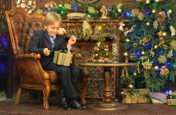 Portrait of little boy with gift  on  Christmas - Fotó, kép