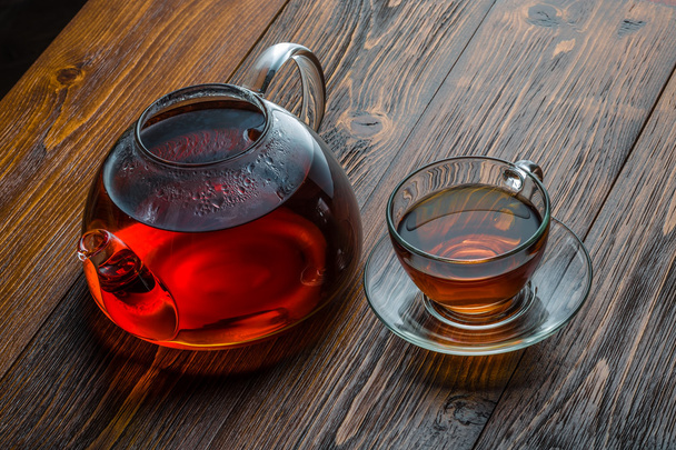 glass teapot on a wooden table - Foto, imagen