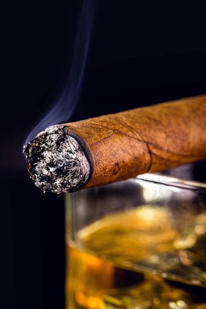 detail of lit cigar, giving off smoke. - Photo, Image
