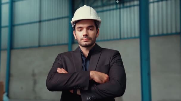 Portrait confident factory manager wearing suit and safety helmet - Felvétel, videó