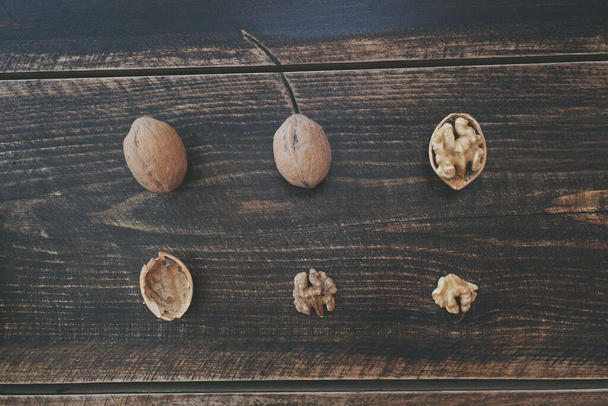 Walnut in wooden background with copy space. Top view. - Φωτογραφία, εικόνα