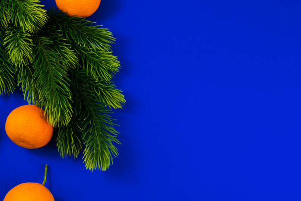 New Year and Christmas attributes and decorations on a beautiful blue background, top view, template - Φωτογραφία, εικόνα