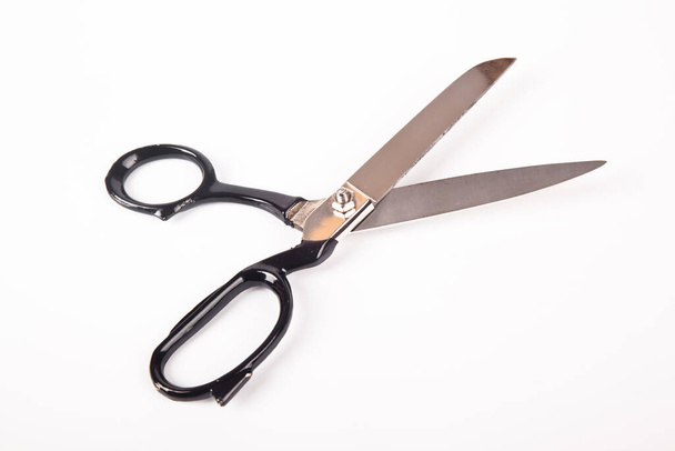 Very sharp retro professional tailor scissors, isolated on white background - Photo, Image