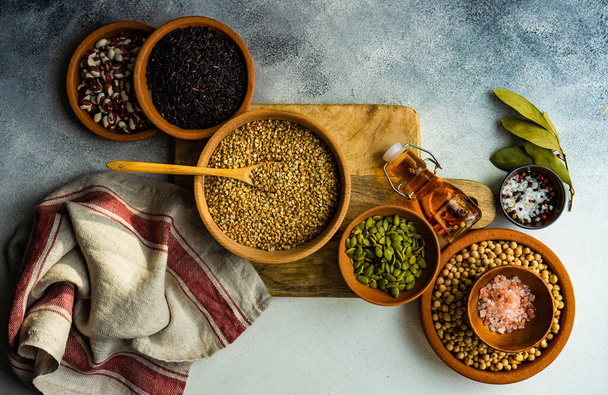 Cooking concept with raw ingredients and spices on rustic background - Foto, afbeelding