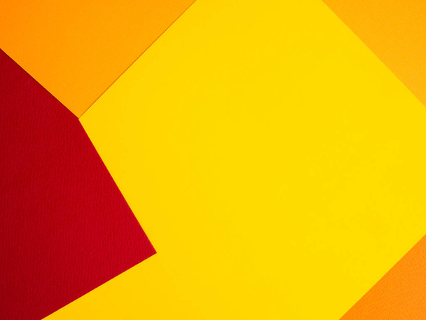 Veelkleurige papieren achtergrond. geel oranje abstract voor zomerachtergrond. - Foto, afbeelding