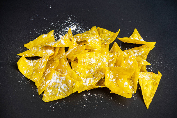 corn chips on the black background - Photo, image