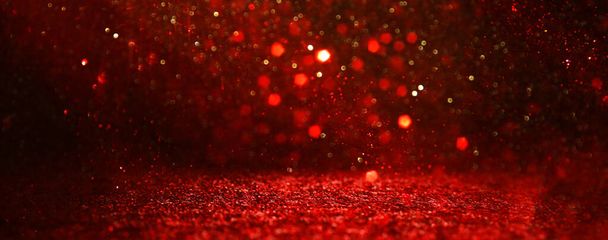 background of abstract red, gold and black glitter lights. defocuse - Foto, immagini