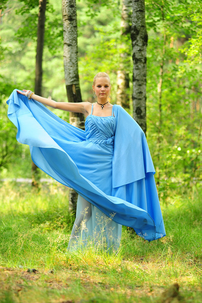 Girl dressed in blue dress - Фото, изображение