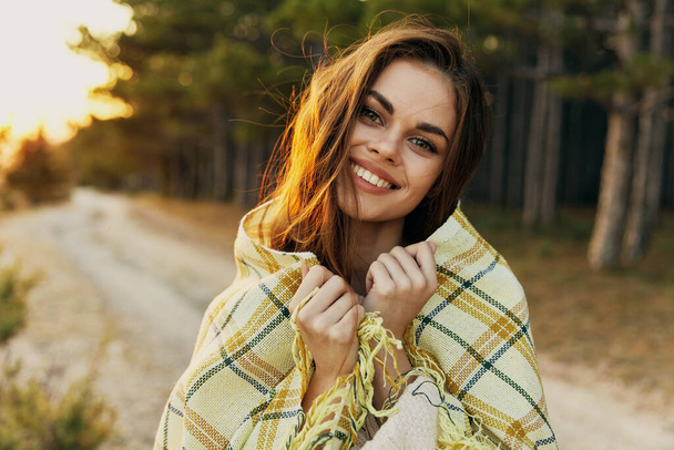 smiling woman in plaid blanket outdoors leisure lifestyle - Photo, Image