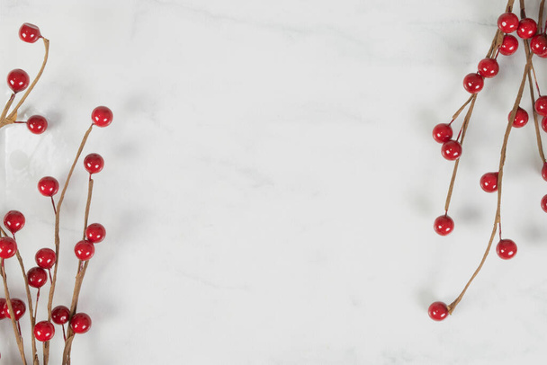 High angle view of cheerful red cranberries merrily posing against a white marble background. - Photo, Image