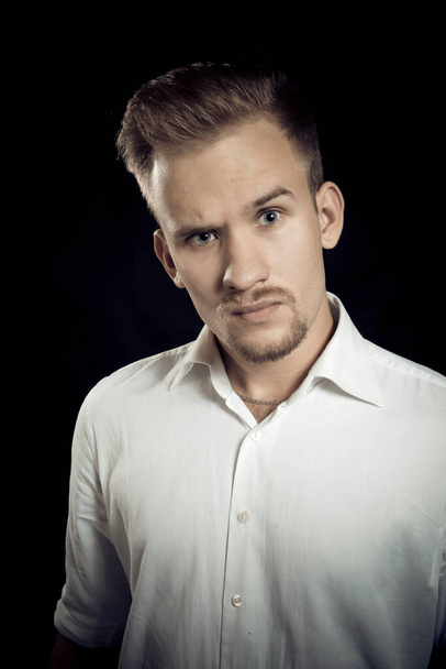 Young man dressed in white shirt studio portrait - Fotografie, Obrázek