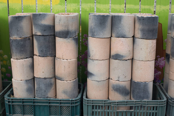 Coal briquet cylindrical solid fuel mixed. briquettes are piled up - Photo, Image