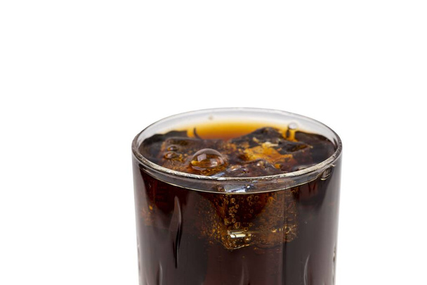 Close up view of top of full glass of soda with ice cubes isolated. Unhealthy drinks concept. Beverage concept. - Photo, Image