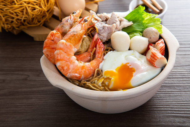 Clay Pot Yee Mee Seafood Noodle Soup with flavorful Cooked Ingredients - Photo, Image
