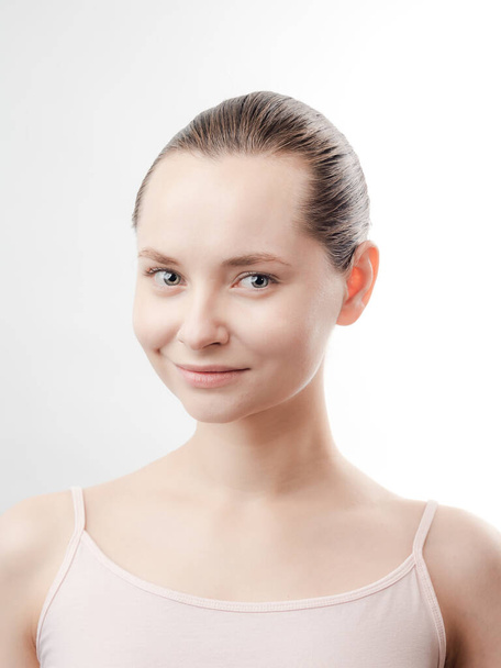 Beautiful Young Woman with Clean Fresh Skin look away .Girl beauty face care. Facial treatment . Cosmetology , beauty and spa. Natural cosmetic product. Concept of Organic, Bio Cosmetics. Isolated on white background. - Photo, image