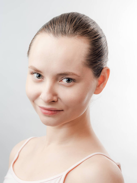 Beautiful Young Woman with Clean Fresh Skin look away .Girl beauty face care. Facial treatment . Cosmetology , beauty and spa. Natural cosmetic product. Concept of Organic, Bio Cosmetics. Isolated on white background. - Valokuva, kuva