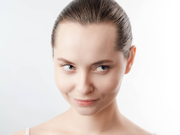 Beautiful Young Woman with Clean Fresh Skin look away .Girl beauty face care. Facial treatment . Cosmetology , beauty and spa. Natural cosmetic product. Concept of Organic, Bio Cosmetics. Isolated on white background. - Fotó, kép