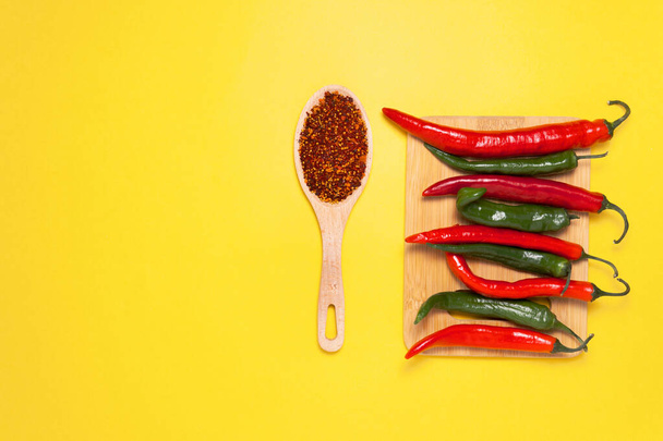 Red Chili Peppers. Green, Peppers. Copy space for your text. Flat lay, top view. kitchen herbs - Foto, Imagem