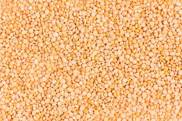 Split peas in brown bowl isolated on white background. - Foto, imagen