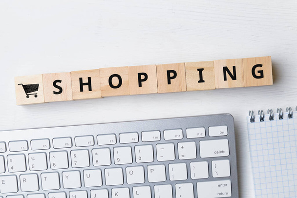 Online shopping concept next to keyboard and notebook. - Foto, immagini