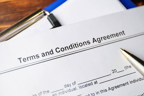 Юридический документ Terms and Conditions Agreement on paper. - Фото, изображение