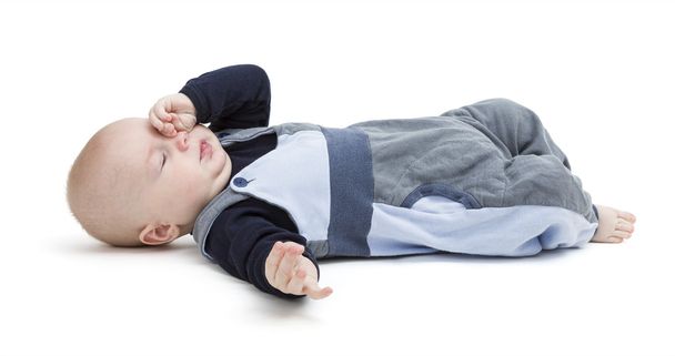 tired baby on floor isolated on white - Photo, Image