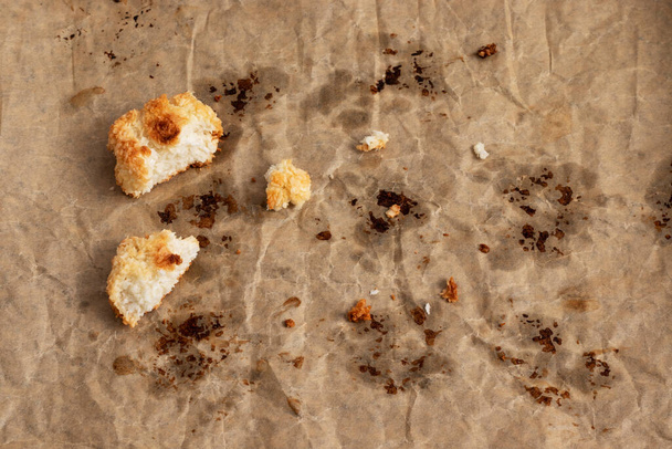 Coconut cookies crumbs on parchment paper. - Photo, Image