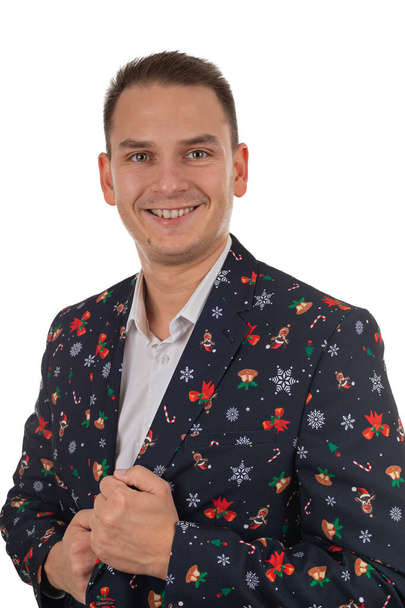 Portrait of young handsome man with christmas style suit posing on isolated background - Foto, afbeelding