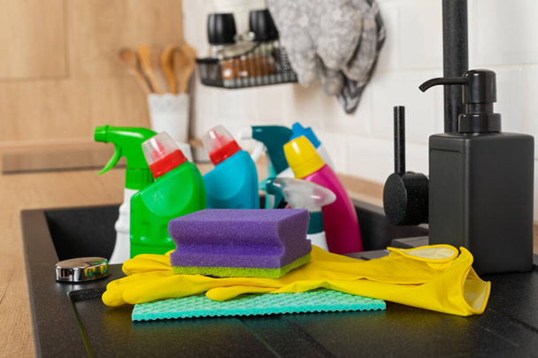 Colorful cleaning products in the kitchen - Foto, afbeelding