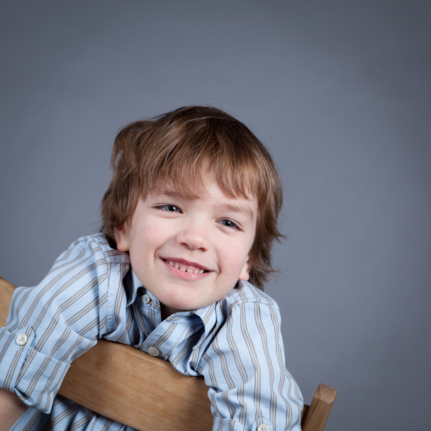 Portrait of happy, joy boy on a gray background - Fotoğraf, Görsel