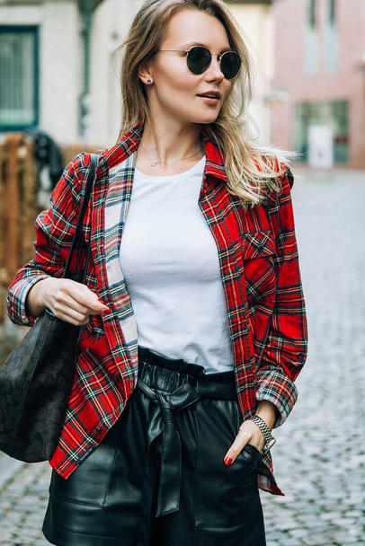 Portrait of pretty stylish blonde girl with sunglasses outdoors - Fotografie, Obrázek