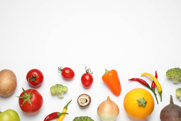 Flat lay composition with fresh vegetables on white background. Space for text - 写真・画像