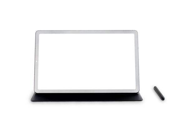 New model 10.4" black tablet is placed on the cover with a pen, blank screen with copy space for text and modern technology concept isolated on white background. Clipping path. - Photo, Image