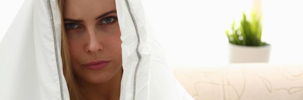 Focused photo on angry woman that being covered in blanket - Photo, Image