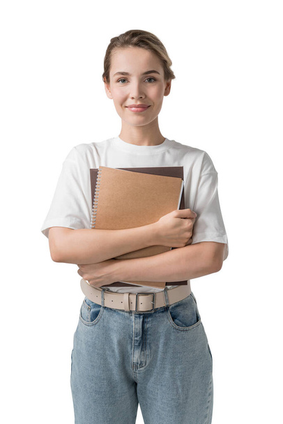 Isolated portrait of smiling young woman holding books. Concept of education - Foto, Imagen