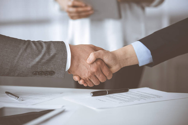 Business people shaking hands finishing contract signing, close-up. Business communication concept. Handshake and marketing - 写真・画像