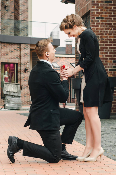 Marriage proposal, man give ring to his girl, young happy couple romantic date, celebrating valentine day - Zdjęcie, obraz