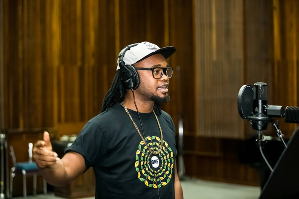 Johannesburg, South Africa - February 17, 2014: African Artist Dontom, Nigeria singing in a SABC recording studio - Фото, зображення
