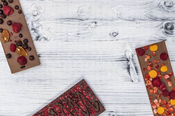 натюрморт из шоколада с различными видами сухофруктов - Фото, изображение