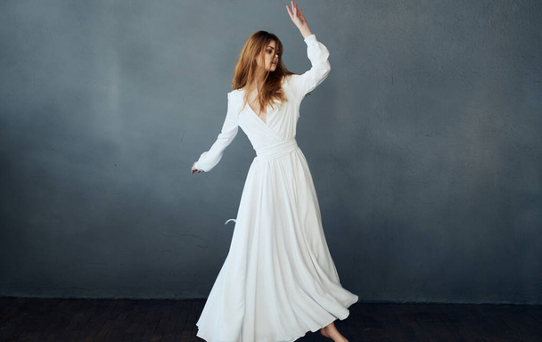 Woman in white wedding dress charm and luxury decoration dark background - Photo, Image