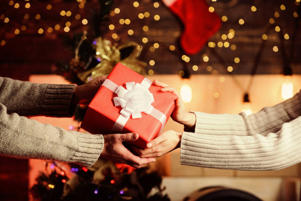 Christmas mood. man give woman box. family values. loving each other. hands of couple in love. merry christmas. happy new year. winter holiday weekend. present for xmas holiday. gift with love - Photo, image
