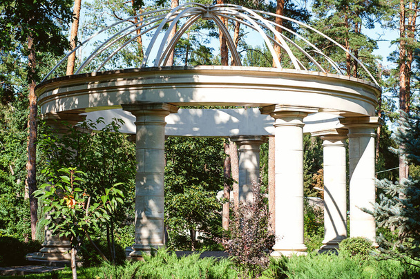 Beautiful marble gazebo in the background of summer park - Photo, Image