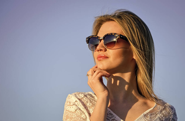 Important thoughts. spring mood. sexy girl with blonde hair on sky background. perfect sunset or sunrise. pretty woman wear sunglasses. female summer fashion. sensual beauty in white dress outdoor - Fotó, kép