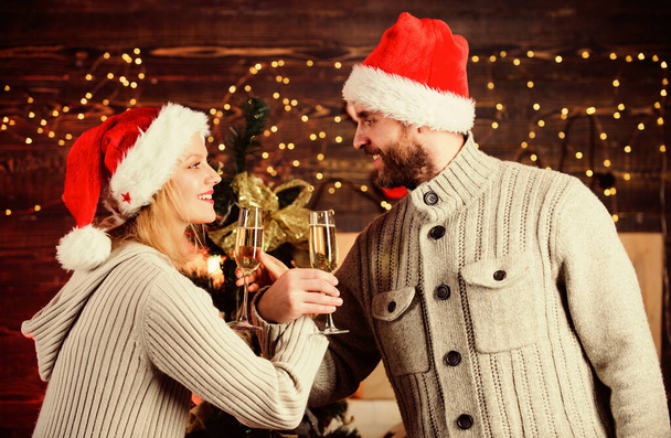 Consolidate friendship with special feast rite. Man and woman simultaneously drink glasses. Celebrating christmas together. Couple in love enjoy christmas holiday celebration. Christmas tradition - Foto, imagen